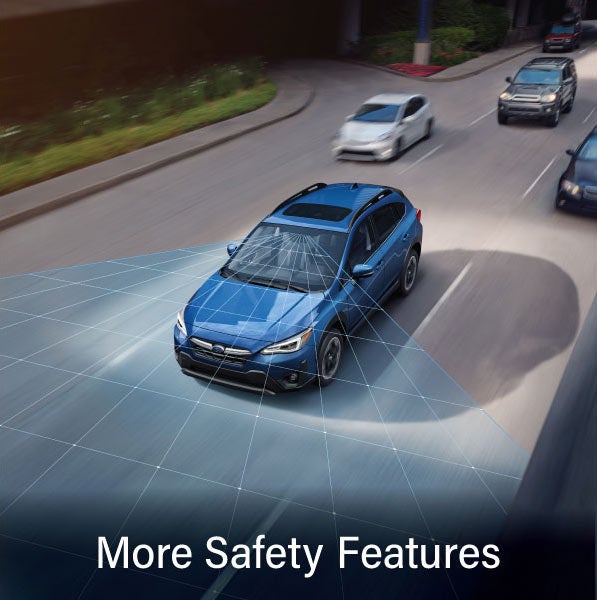 A Subaru Crosstrek in blue with the words &ldquo;More Safety Features&ldquo;. | Frederick Subaru in Frederick MD